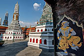 Bangkok Grand Palace, murals of the gallery of the Wat Phra Kaew, a monkey warrior (Geyoon) from the Ramakien, on the background the prangs of the eastern wall. 